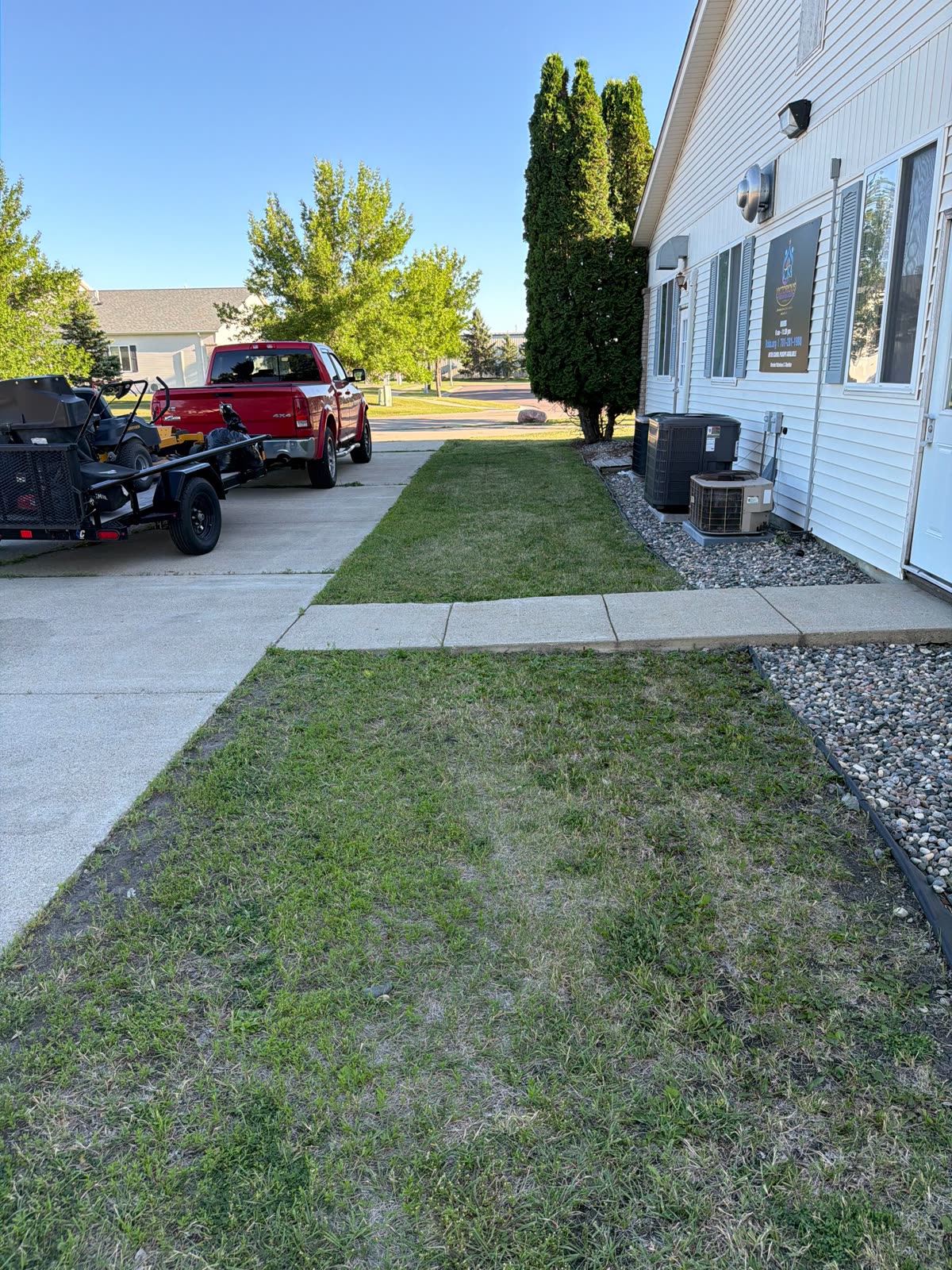 BravHeart truck and equipment trailer parked at a Fargo job site